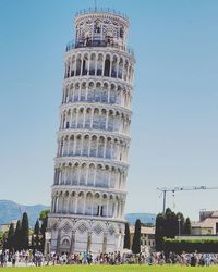 Tourists against clear sky