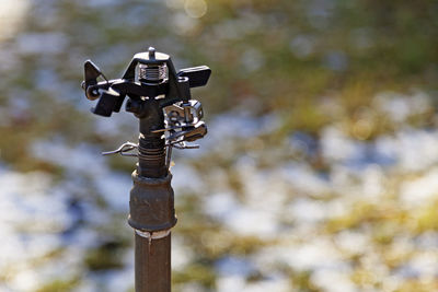 Low angle view of lighting equipment on pole