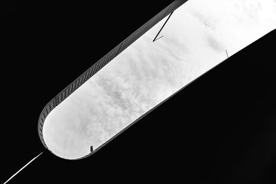 Low angle view of silhouette building against sky