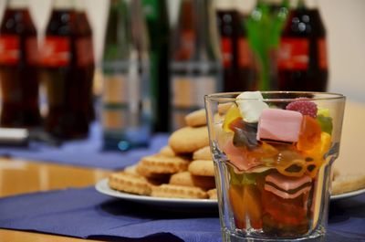 Close-up of food in glass and plate on table