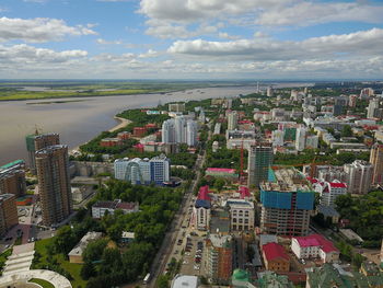 High angle view of buildings in city against sky