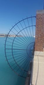 Ferris wheel against clear blue sky
