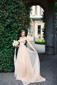 Rear view of bride standing on street