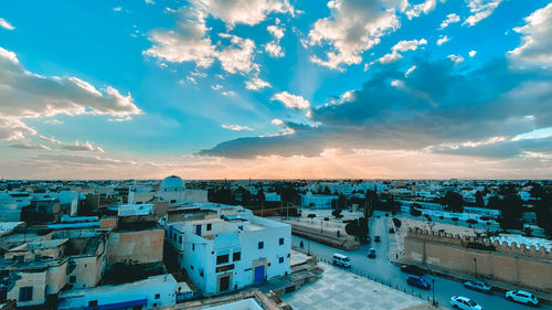 High angle view of buildings in city against sky