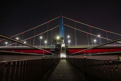 View of suspension bridge at night