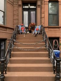 Low angle view of skeletons on staircase of building