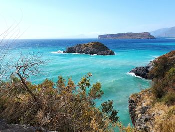 Scenic view of sea against clear blue sky