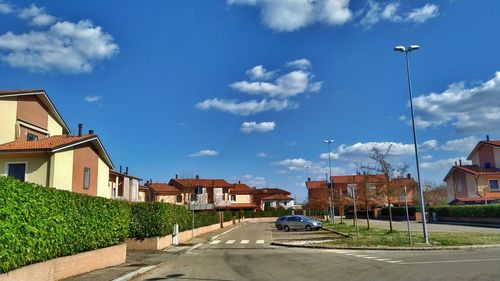 Street amidst buildings against sky