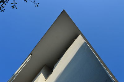 Low angle view of building against clear blue sky