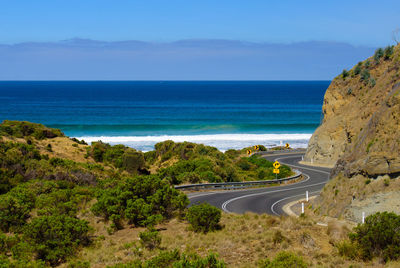 High angle view of road by sea against sky