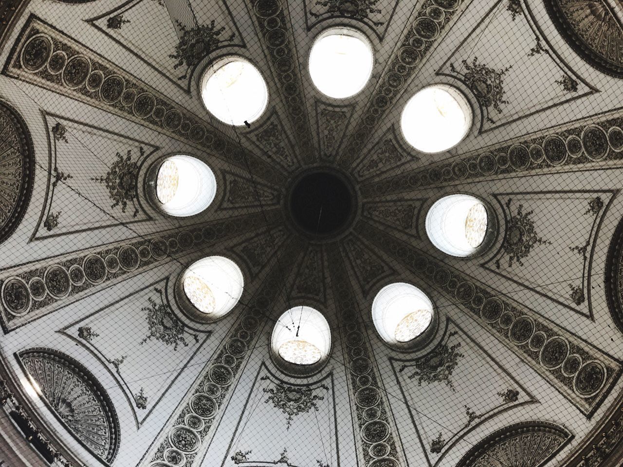 ceiling, architecture, indoors, dome, low angle view, built structure, architectural feature, ornate, design, illuminated, pattern, cupola, history, no people, travel destinations, architectural design, day