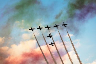 Low angle view of airplane against sky