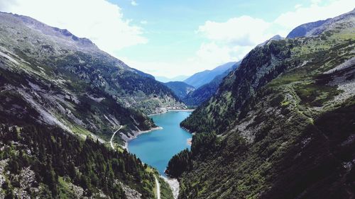 Panoramic view of trees and mountains against sky