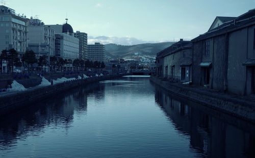 View of canal with buildings in background