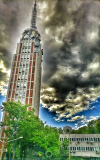 Low angle view of building against cloudy sky