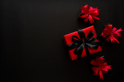 Directly above shot of christmas decorations against black background