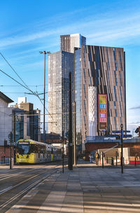 View of city buildings against sky