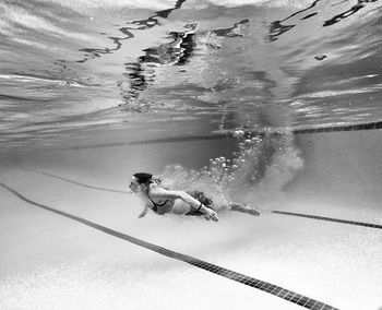 Woman swimming in pool