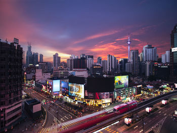 High angle view of illuminated buildings in city against sky