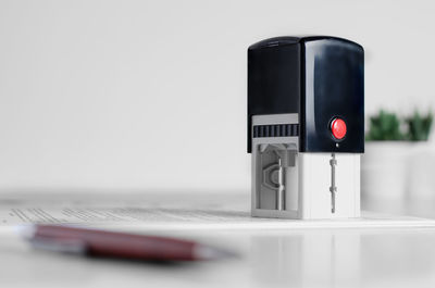 Close-up of telephone booth against white background