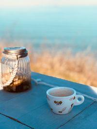 Close-up of coffee cup on table