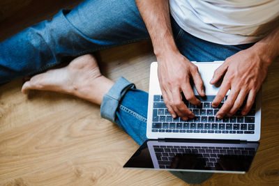 Bearded freelancer using laptop at home