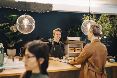 Portrait of people sitting at restaurant