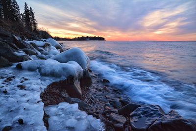 Scenic view of sea against sky during sunset