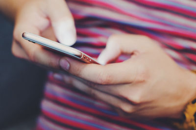 Close-up of woman using mobile phone