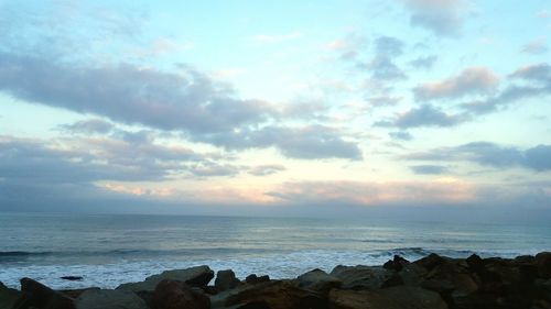 Scenic view of sea against cloudy sky