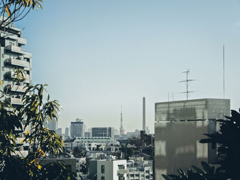 Modern cityscape against clear sky