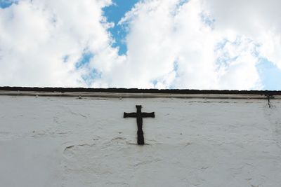Panoramic view of cross against sky