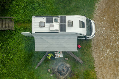 High angle view of telephone booth on grass