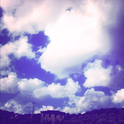 Low angle view of built structure against cloudy sky