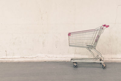 View of shopping cart against wall