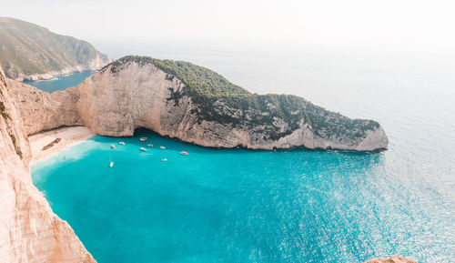 Rock formations in sea against sky