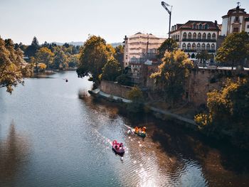 High angle view of river amidst trees against sky