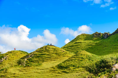 Low angle view of mountains against cloudy sky