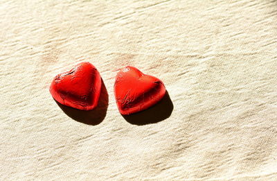 High angle view of red shoes on sand