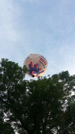 Low angle view of balloons against sky