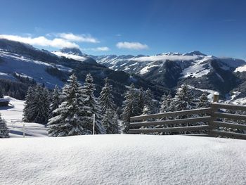 Scenic view of snow covered mountains against sky