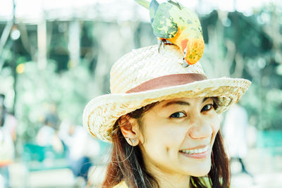 Portrait of young woman in hat