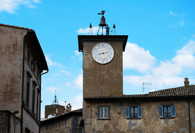 Low angle view of clock tower against sky