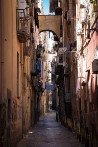 Narrow alley amidst buildings in town