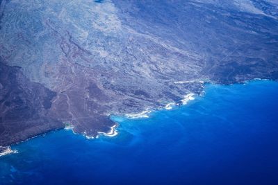 High angle view of man swimming in sea