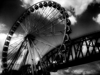 Low angle view of ferris wheel against sky