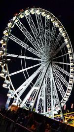 Low angle view of ferris wheel at night