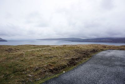 Scenic view of sea against cloudy sky