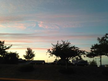 Scenic view of landscape against sky at sunset