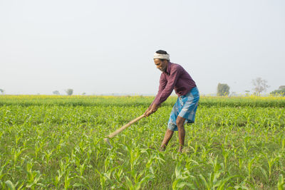 Full length of woman standing on field